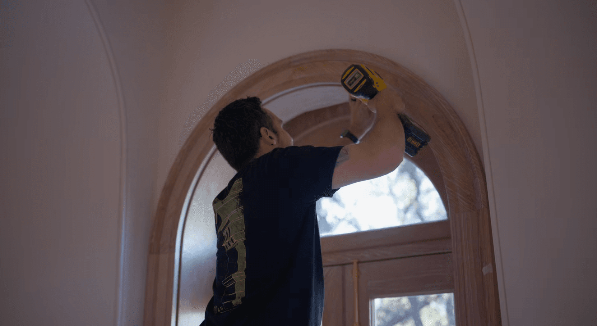 Custom arched doorway trim installation